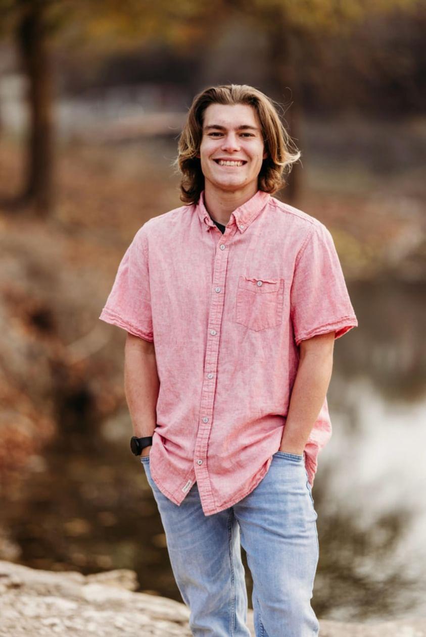 Nik standing majestically with his long hair (rip the long hair)